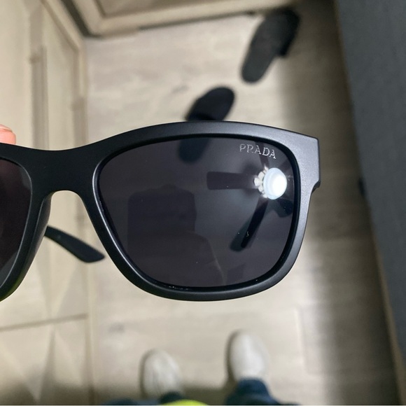 Prada Black Sunglasses with Sleek Frame and Dark Lenses - Picture 1 of 11